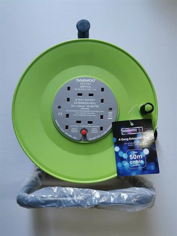 50m heavy duty extension cable reel with 4 × 13A socket outlets and green cable on carry handle frame